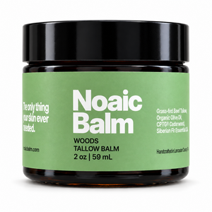 Noaic Balm Woods tallow balm, 2 oz jar with the new label on a white background.